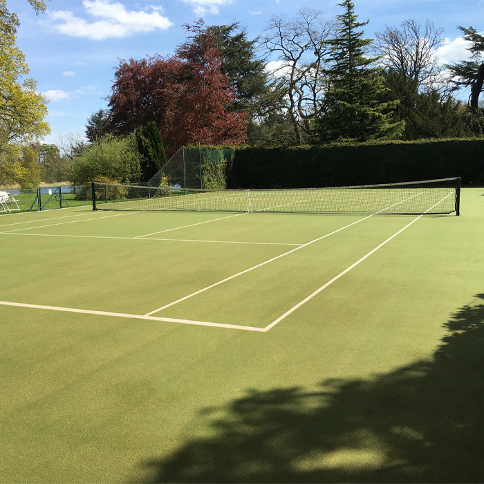 Artificial grass tennis court maintenance after applying the treatment